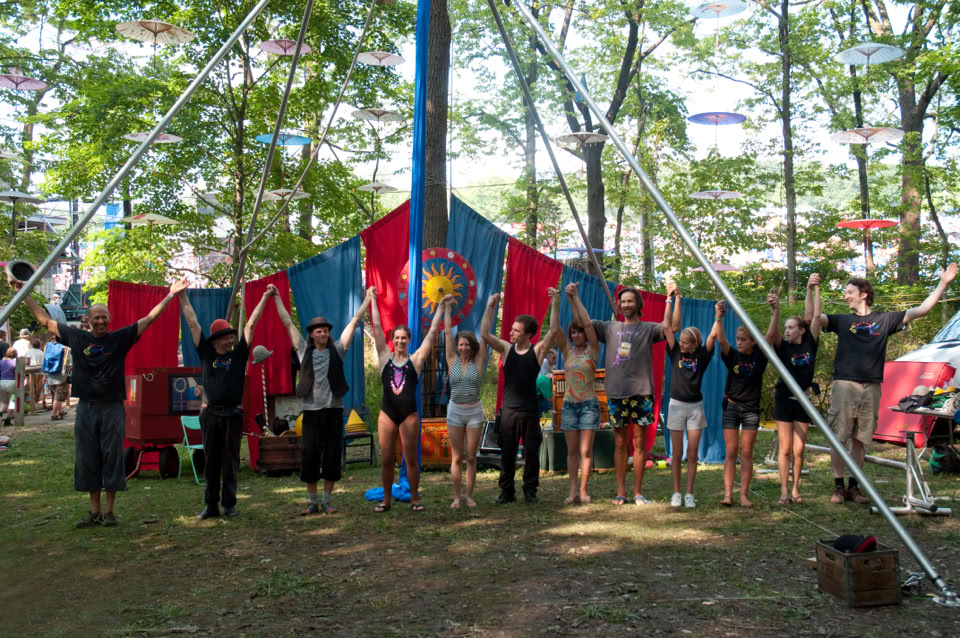 group of performers taking a bow on an outdoor stage