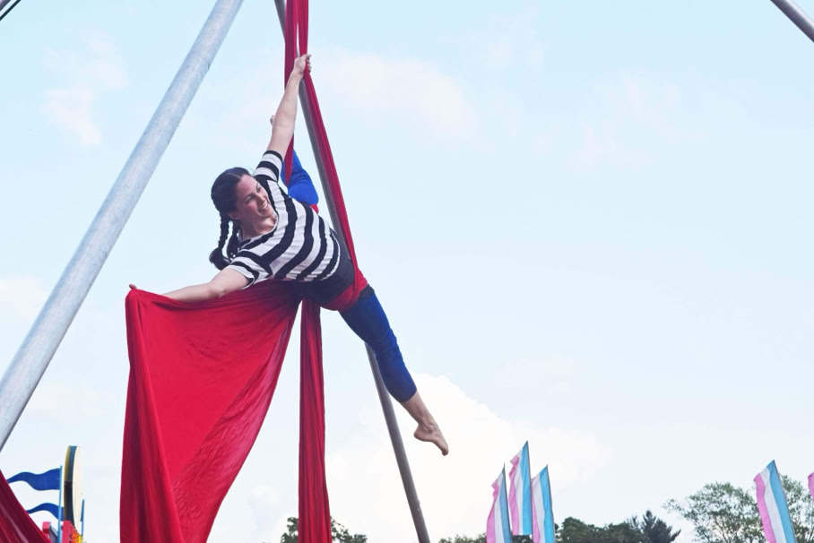 aerial silks performer against the sky