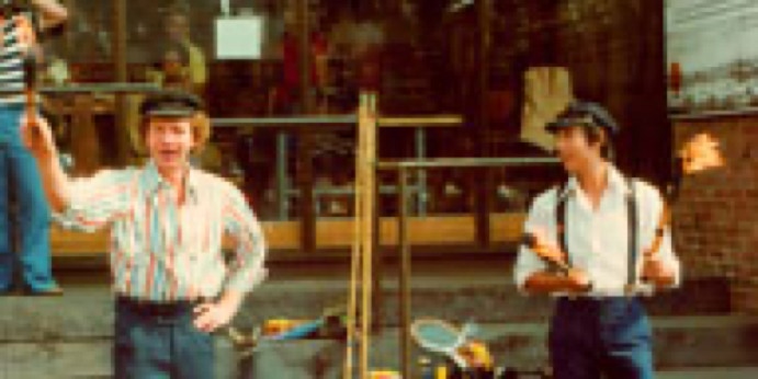 two fire jugglers street performing 