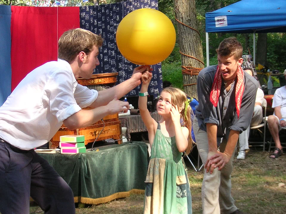 spinning a yellow ball on a girls finger